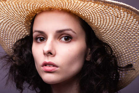 beautiful girl in the hat portrait studio