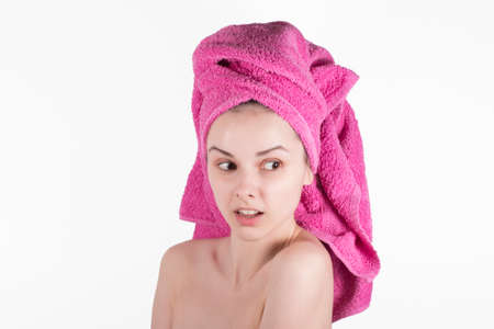 young woman in a towel on her head after showerの写真素材