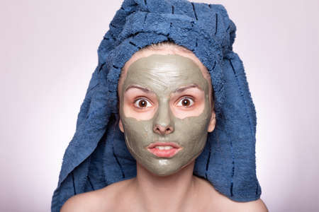girl with a cosmetic mask on her face, after a shower, skin care