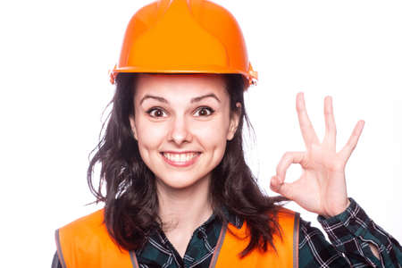 beautiful woman builder in hard hatの写真素材
