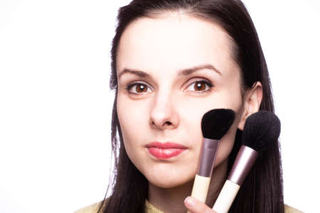 attractive girl does makeup, makeup brushの写真素材