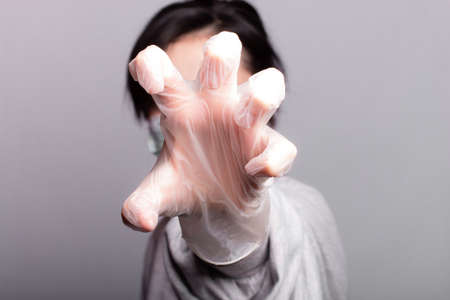 woman in medical mask and gloves fights the virus, health care