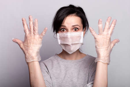 woman in medical mask and gloves fights the virus, health careの写真素材