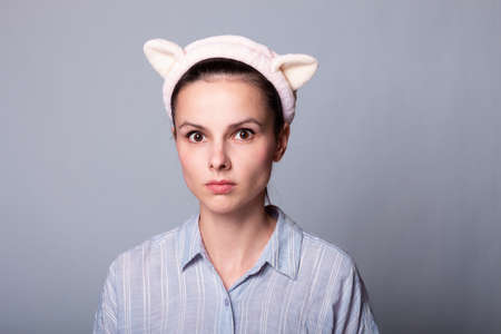 beautiful girl in a funny bandage for washingの写真素材