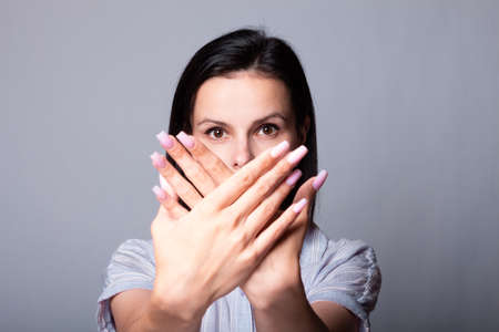 woman in shirt, gray backgroundの写真素材