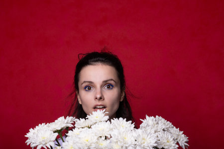 woman in love and holding a large bouquet of flowers