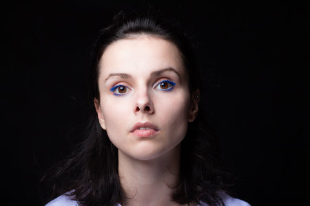 young girl portrait, studio black background