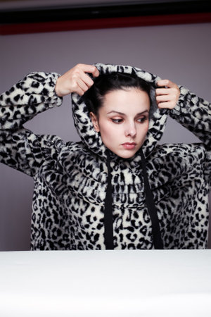 young girl, gray studio backgroundの写真素材