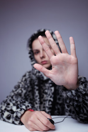 portrait of a girl in a leopard sweatshirt, studio backgroundの写真素材