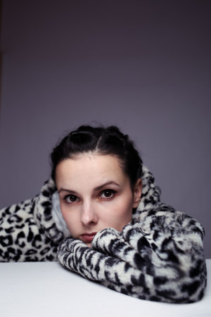 portrait of a girl in a leopard sweatshirt, studio background