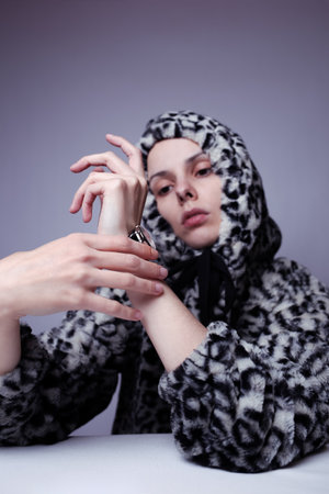woman in a sweatshirt with a hood, art portraitの写真素材