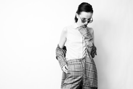 woman in office suit and glasses, black and white photographyの写真素材