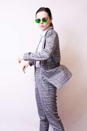 businesswoman in a suit and green glassesの写真素材
