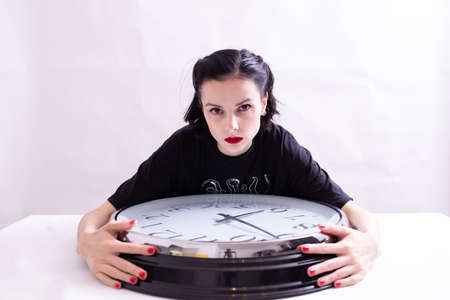 beautiful woman with big clock