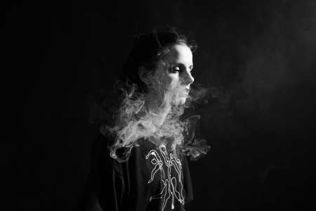 woman smokes, black and white photography