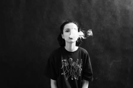 woman smokes, black and white photography