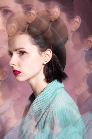 art portrait, woman with pink lipstick in black hat and corduroy jacket. High quality photoの写真素材