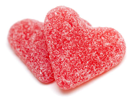 two heart-shaped candies isolated on white backgroundの写真素材