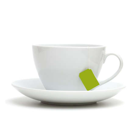 Cup of tea with tea bag (blank label) on white backgroundの写真素材
