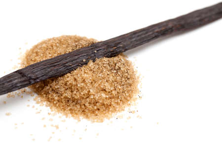 vanilla bean and brown vanilla sugar isolated on white backgroundの写真素材