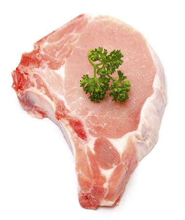piece of meat and twig of parsley isolated on white backgroundの写真素材