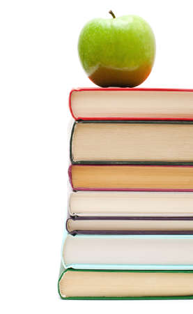 apple on stack of books isolated on whiteの写真素材