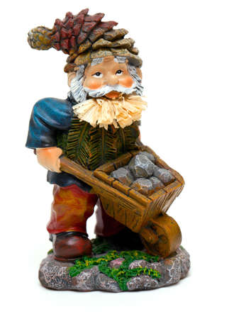 colorful statue of a mountain worker with stones isolated on whiteの写真素材