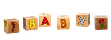 children's alphabet blocks spelling the word "BABY" on a white backgroundの写真素材