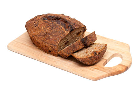 home-made bread from rye flour lying on cutting board isolated on white background