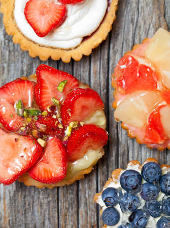 Closeup of fancy gourmet fresh fruit dessert tartsの写真素材
