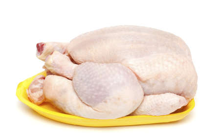 raw chicken on plastic plate isolated on white backgroundの写真素材