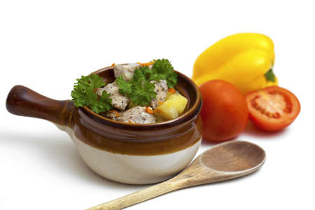 chicken in pot and vegetables isolated on whiteの写真素材