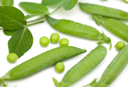 pods of fresh pea isolated on whiteの写真素材