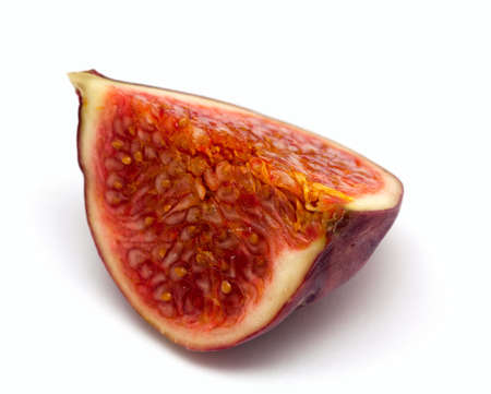 freshly cut piece of fig isolated on white backgorund