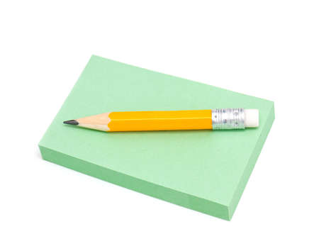 note paper and grey pencil isolated on white backgroundの写真素材
