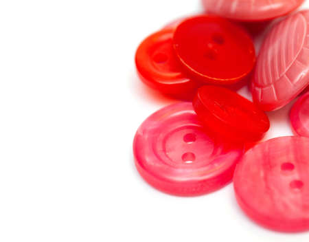 red and pink sewing buttons and empty space for your text