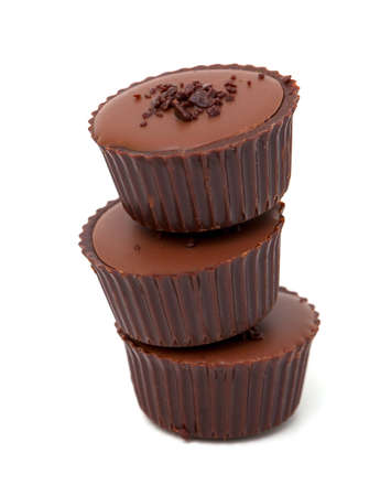 stack of chocolate candies isolated on white backgroundの写真素材