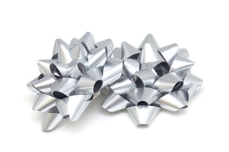 silver gift ribbons isolated on white backgroundの写真素材