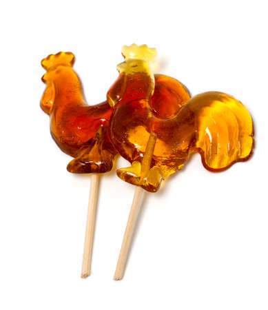 Russian lollipop in the form of rooster on white backgroundの写真素材