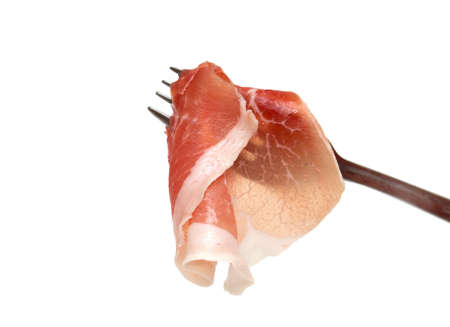 smoked meat on fork isolated on white backgroundの写真素材