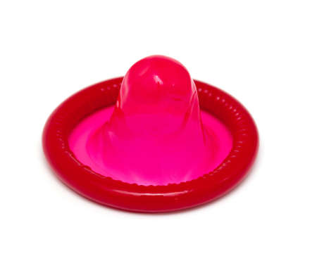 red condom isolated on white backgroundの写真素材