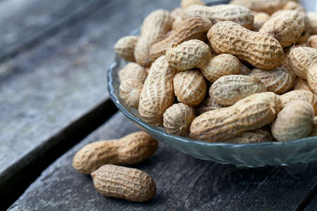 peanuts on wooden tableの写真素材