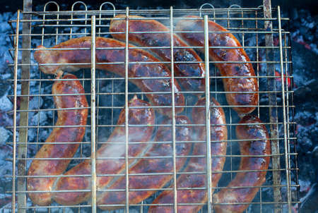 sausages on grill outdoorの写真素材