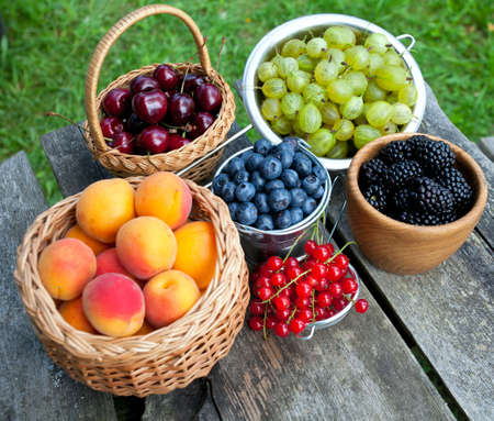 different berries on wooden tableの写真素材