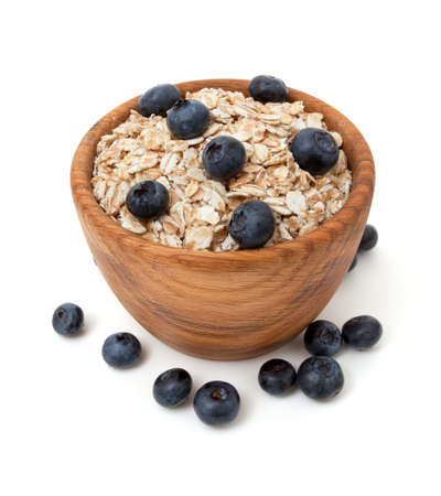 Blueberries and oats over whiteの写真素材