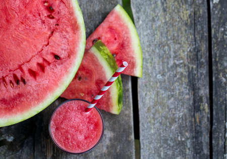 Water melon smoothie on garden tableの写真素材