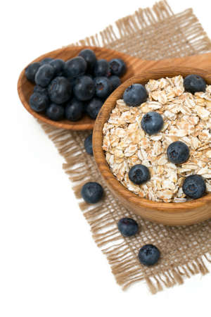 Blueberries and oats over whiteの写真素材
