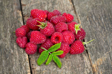raspberries on wooden surface