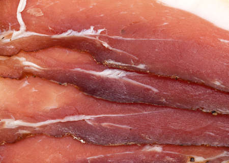 cured ham isolated on white backgroundの写真素材