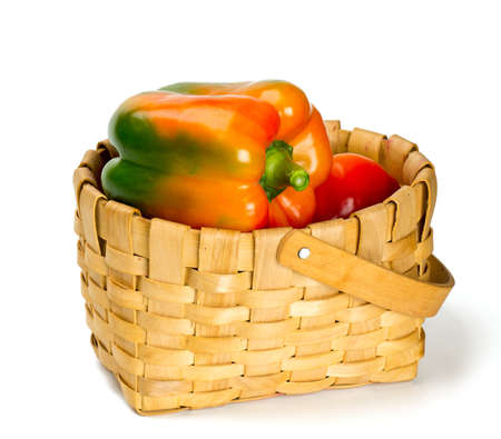 paprika in basket over whiteの写真素材
